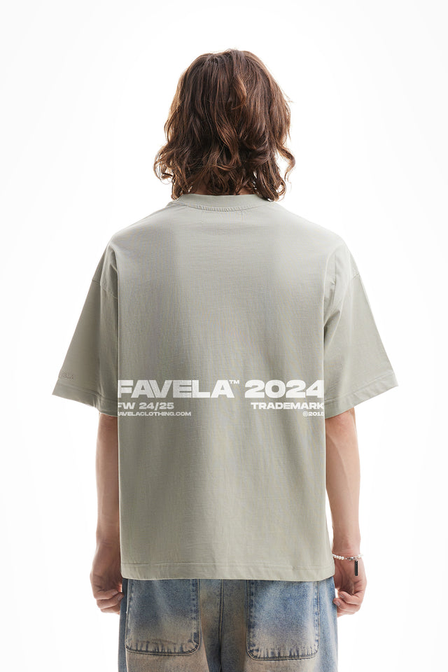 Overzised T-Shirt in Sea Grass and Favela 2024 Backprint.
