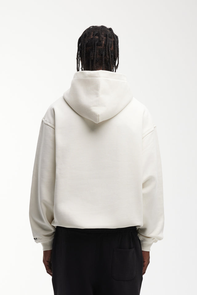 Back view of Model that wears vanilla overzised frontzip hoodie