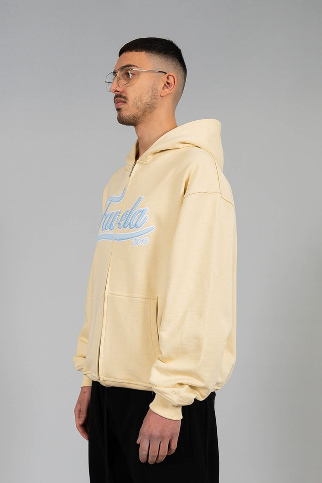 Side view of Cream Front Zip Hoodie by Favela with 3D Logo